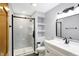 Modern bathroom features a glass shower, white vanity, and neutral paint at 725 Queenswood Dr, Indianapolis, IN 46217