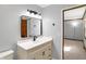Modern bathroom features a white vanity and neutral paint at 725 Queenswood Dr, Indianapolis, IN 46217