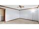 Bright bedroom features a ceiling fan, neutral carpet, and an open door at 725 Queenswood Dr, Indianapolis, IN 46217