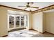 Sunny breakfast nook with tile flooring and a large window overlooking backyard at 725 Queenswood Dr, Indianapolis, IN 46217