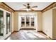 Dining room featuring a ceiling fan, bay window, and tiled floor at 725 Queenswood Dr, Indianapolis, IN 46217