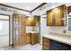 Kitchen featuring light wood cabinetry and tile flooring at 725 Queenswood Dr, Indianapolis, IN 46217