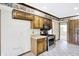 Eat-in kitchen featuring light wood cabinetry and tile flooring at 725 Queenswood Dr, Indianapolis, IN 46217