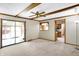 Bright and airy living room provides access to the sunroom and kitchen at 725 Queenswood Dr, Indianapolis, IN 46217