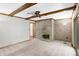 Cozy carpeted living room features a brick fireplace and a ceiling fan for added comfort at 725 Queenswood Dr, Indianapolis, IN 46217