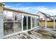 Enclosed patio offering an outdoor living space, wood deck and sliding glass door at 725 Queenswood Dr, Indianapolis, IN 46217
