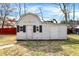 A backyard storage shed with an barn-style gambrel roof, and gray siding at 725 Queenswood Dr, Indianapolis, IN 46217