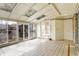 Bright sunroom with tiled floor, and multiple windows at 725 Queenswood Dr, Indianapolis, IN 46217