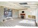 Inviting sunroom with stone accent wall, fireplace, and skylights at 725 Queenswood Dr, Indianapolis, IN 46217