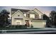 Charming two-story home featuring varied siding, a two-car garage, and professionally landscaped front yard at 7384 Standish Ln, Avon, IN 46123