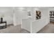 Upstairs hallway with view into bedroom and stylish decor at 7384 Standish Ln, Avon, IN 46123