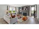 The open living room has a fireplace, lots of natural light, stylish furniture, and neutral tones at 7384 Standish Ln, Avon, IN 46123