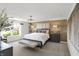 Bright main bedroom with stylish wood accent wall, and modern furnishings at 7384 Standish Ln, Avon, IN 46123