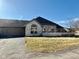 Charming single-story home featuring brick facade, attached garage, and well-maintained front yard at 7437 Vineyard Dr, Fishers, IN 46038