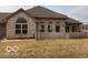 Charming single-story home with brick facade, arched windows, and well-maintained front yard at 7437 Vineyard Dr, Fishers, IN 46038