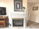 Close up of the fireplace, highlighted by a decorative mantle and hearth at 7437 Vineyard Dr, Fishers, IN 46038