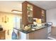 View of kitchen with breakfast bar, wood cabinets and tile floor at 7437 Vineyard Dr, Fishers, IN 46038
