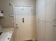 Clean laundry room with a washer, dryer and ample cabinet storage at 7437 Vineyard Dr, Fishers, IN 46038