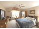 Well-lit primary bedroom features vaulted ceiling, carpet flooring and large window at 7437 Vineyard Dr, Fishers, IN 46038