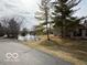 A serene pond with a fountain, surrounded by greenery, and enhancing the natural beauty of the community at 7437 Vineyard Dr, Fishers, IN 46038