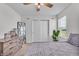 Bright bedroom with a big window and carpeted floor at 7450 Leatherwood Dr, Indianapolis, IN 46259