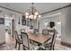 Bright dining room with wooden table, seating for six, and modern decor at 7450 Leatherwood Dr, Indianapolis, IN 46259
