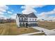 Beautiful two-story home with a modern exterior, well-maintained lawn, and a two-car garage at 7450 Leatherwood Dr, Indianapolis, IN 46259