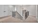Upstairs hallway with carpet, a modern chandelier, and white doors at 7450 Leatherwood Dr, Indianapolis, IN 46259