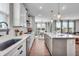 Modern kitchen featuring white cabinets, quartz countertops, and stainless steel appliances at 7450 Leatherwood Dr, Indianapolis, IN 46259