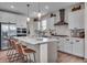 Gourmet kitchen with white cabinets, stainless steel appliances, and a large center island at 7450 Leatherwood Dr, Indianapolis, IN 46259