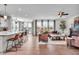 Spacious open-concept layout with a modern kitchen, dining area, and comfortable living space featuring hardwood floors at 7450 Leatherwood Dr, Indianapolis, IN 46259