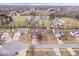 Aerial view of the property and surrounding neighborhood highlighting the pond at 8333 Hunters Meadow Ct, Indianapolis, IN 46259