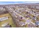 A wide aerial shot of a neighborhood featuring homes, ponds, and curving streets at 8333 Hunters Meadow Ct, Indianapolis, IN 46259