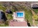 Overhead view of a backyard pool, patio and home showcasing a well-maintained property at 8333 Hunters Meadow Ct, Indianapolis, IN 46259
