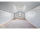 Attic with carpet flooring, light gray walls and a small window at 8333 Hunters Meadow Ct, Indianapolis, IN 46259