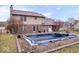 Lovely backyard showcasing an in-ground pool and well-maintained lawn at 8333 Hunters Meadow Ct, Indianapolis, IN 46259