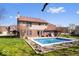 This backyard oasis features a pool and well-maintained landscaping at 8333 Hunters Meadow Ct, Indianapolis, IN 46259