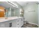 The bathroom features a double vanity, modern fixtures and lighting, plus a tub-shower combo at 8333 Hunters Meadow Ct, Indianapolis, IN 46259