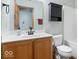 Bathroom boasts a white countertop, a wood vanity, and a shower/tub combo at 8333 Hunters Meadow Ct, Indianapolis, IN 46259