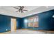 The primary bedroom includes modern vinyl floors, a fan, and natural light from the window and bathroom access at 8333 Hunters Meadow Ct, Indianapolis, IN 46259