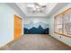 Inviting bedroom features neutral carpet, tray ceiling, and a striking mountain mural for a playful touch at 8333 Hunters Meadow Ct, Indianapolis, IN 46259