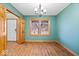 Inviting dining room boasting hardwood floors and a modern chandelier for a cozy atmosphere at 8333 Hunters Meadow Ct, Indianapolis, IN 46259