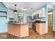 Spacious kitchen with stainless steel appliances, light wood cabinets, and stylish granite countertops at 8333 Hunters Meadow Ct, Indianapolis, IN 46259