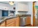 Kitchen featuring stainless steel dishwasher, granite countertops, and modern sink at 8333 Hunters Meadow Ct, Indianapolis, IN 46259