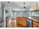 Spacious kitchen featuring stainless steel appliances, granite countertops, and ample cabinet space at 8333 Hunters Meadow Ct, Indianapolis, IN 46259