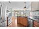 Spacious kitchen with stainless appliances, granite countertops, and lots of natural light at 8333 Hunters Meadow Ct, Indianapolis, IN 46259