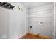 Bright laundry room boasts wire shelving, wood-look flooring and gray walls at 8333 Hunters Meadow Ct, Indianapolis, IN 46259
