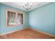 Living room featuring new floors, crown moulding and a large window for ample natural light at 8333 Hunters Meadow Ct, Indianapolis, IN 46259