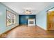 Bright living room with hardwood floors, fireplace, and ample natural light at 8333 Hunters Meadow Ct, Indianapolis, IN 46259