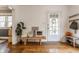 Stylish entryway featuring hardwood floors, a bench, and coat storage for a functional design at 837 Tecumseh St, Indianapolis, IN 46201